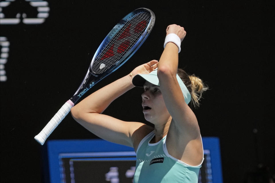 Magda Linette of Poland celebrates after defeating Karolina Pliskova of the Czech Republic in their quarterfinal match at the Australian Open tennis championship in Melbourne, Australia, Wednesday, Jan. 25, 2023. (AP Photo/Dita Alangkara)