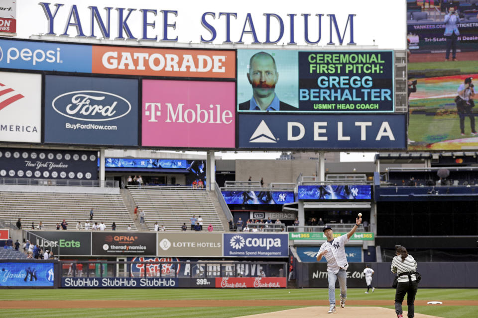 U.S. men's national soccer team head coach Gregg Berhalter throws out a ceremonial first pitch before the first baseball game of a doubleheader between the Minnesota Twins and the New York Yankees on Wednesday, Sept. 7, 2022, in New York. (AP Photo/Adam Hunger)