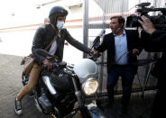 Neurologist Leopoldo Luque, Diego Maradona's former personal doctor, leaves Olivos Clinic where the late soccer star remained hospitalized after undergoing an operation in Buenos Aires, Argentina, Wednesday, Nov. 11, 2020. Luque's home and offices are being raided Sunday in the midst of investigations to establish the circumstances of the death of the former soccer star. (AP Photo/Natacha Pisarenko)