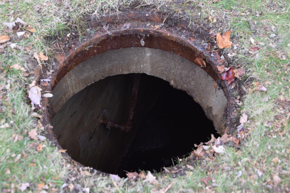 Underneath manhole covers, two separate underground rooms are hidden beneath the back yard.