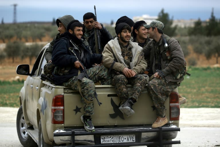 Manbij Military Council forces, part of the US-backed Syrian Democratic Forces, prepare to head to the frontlines on the outskirts of the northern Syrian town of Manbij on March 3, 2017