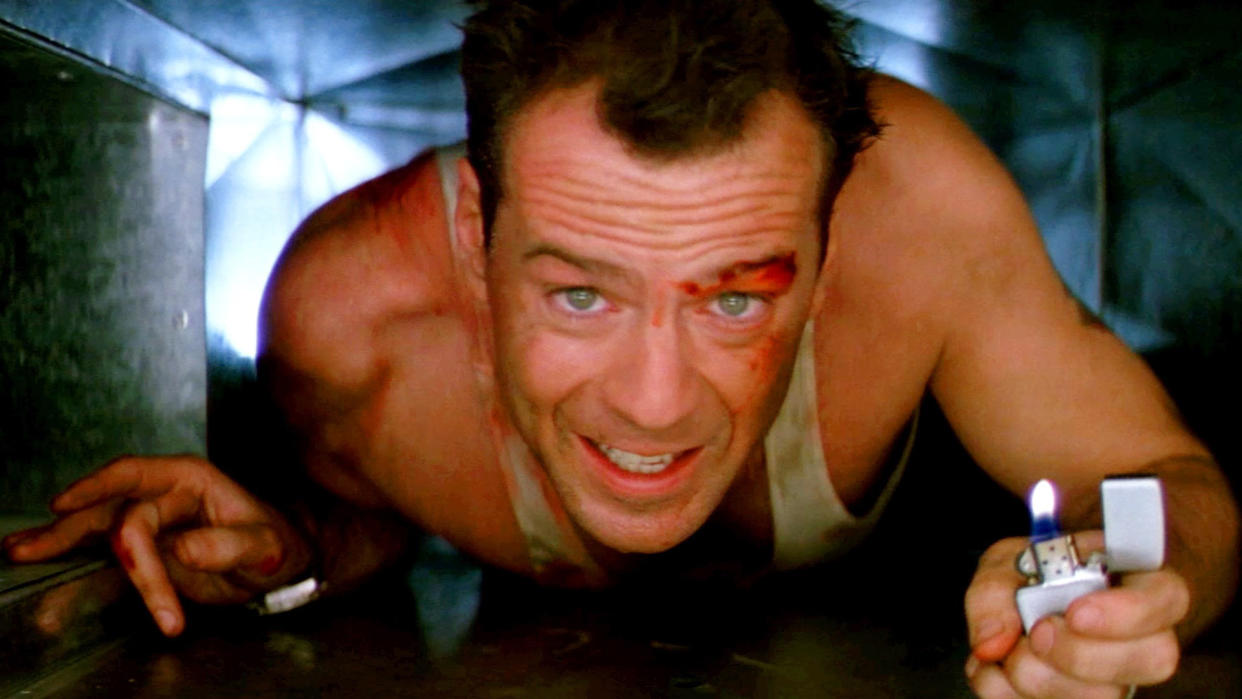  A still from the movie Die Hard in which Bruce Willis plays John McClane as he crawls through a vent. 