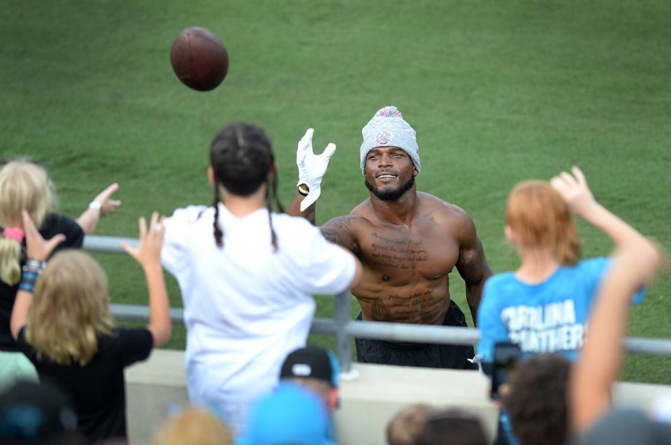 Carolina Panthers linebacker Denzel Perryman plays catch with fans along the sideline of Gibbs Stadium in Spartanburg, SC on Saturday, July 31, 2021. The team held their practice at Gibbs Stadium as part of the NFLÕs Training Camp: Back Together Saturday celebrating the return of fans and football. Jeff Siner/jsiner@charlotteobserver.com