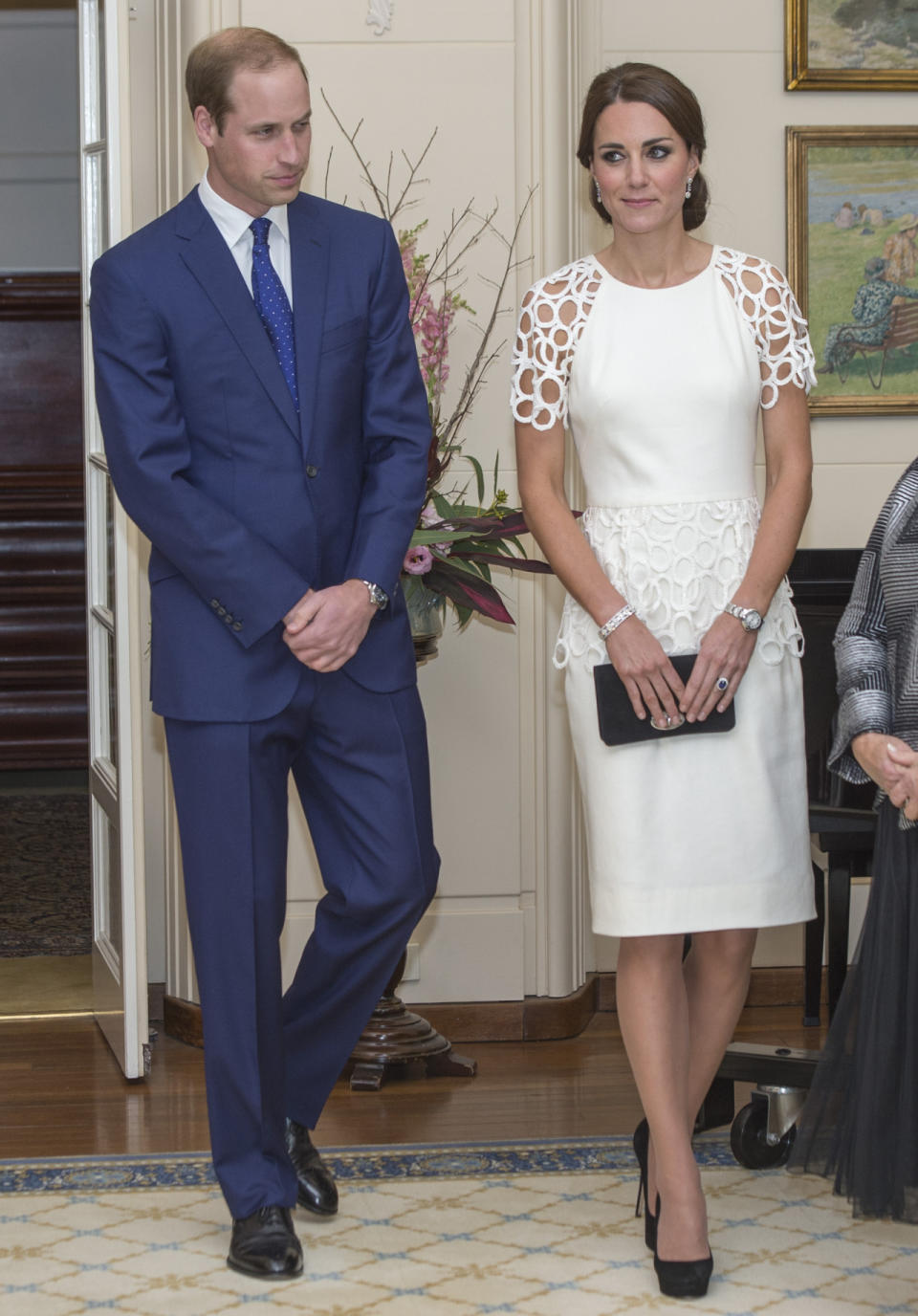 <p>For a reception in Australia, Kate donned a chic white dress by Lela Rose. Jimmy Choo heels and a Mulberry clutch topped off her outfit. </p><p><i>[Photo: PA]</i></p>