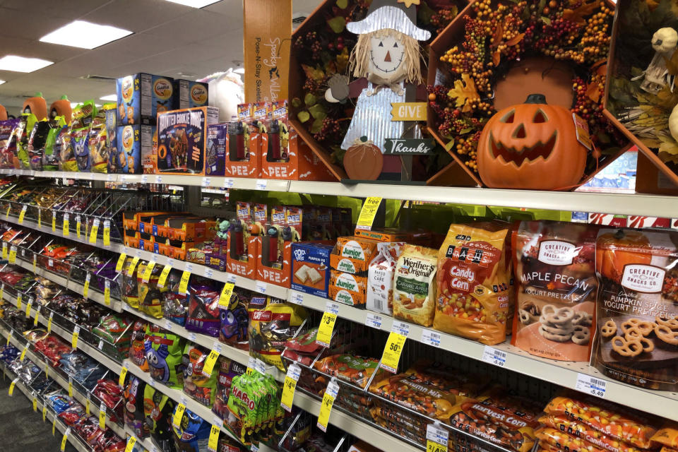 Halloween candy and decorations are displayed at a store, Wednesday, Sept. 23, 2020, in Freeport, Maine. U.S. sales of In this year of the pandemic, with trick-or-treating still an uncertainty, Halloween candy were up 13% over last year in the month ending Sept. 6, according to data from market research firm IRI and the National Confectioners Association. (AP Photo/Robert F. Bukaty)