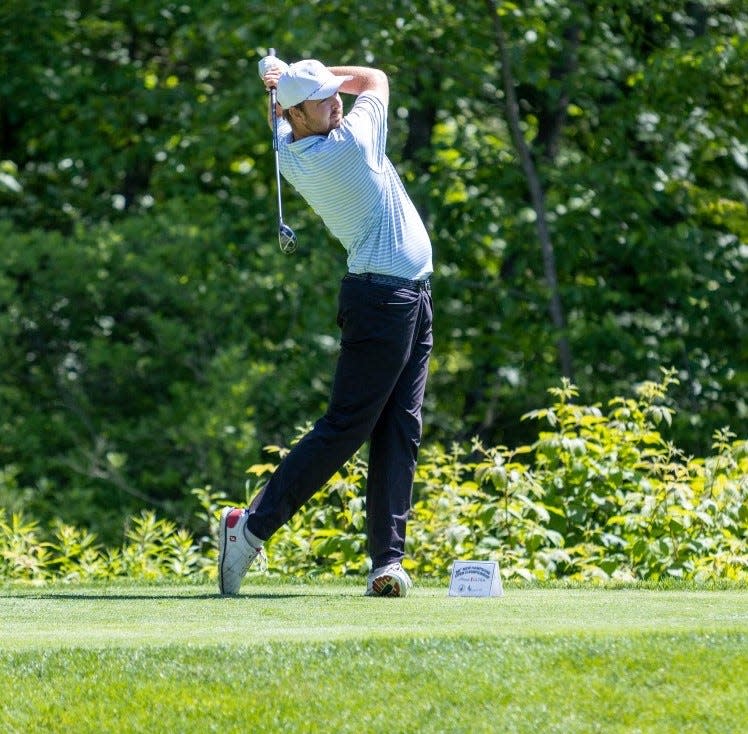 North Hampton's Ryan Quinn follows the flight of his drive during the opening round of Thursday's New Hampshire Open at Breakfast Hill Golf Club in Greenland.