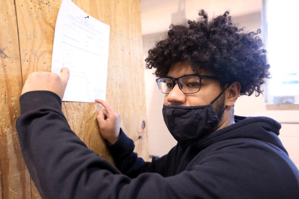 Julian Reyes reviews a project plan during class at Hudson Valley Community College in Troy on February 22, 2022. Reyes is a student in the college's Electrical Construction and Maintenance program. 