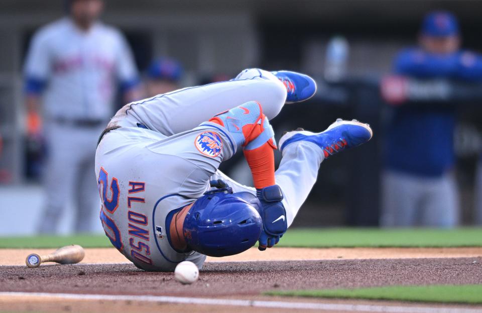 New York Mets first baseman Pete Alonso reacts after being hit by a pitch during the second inning against the San Diego Padres.