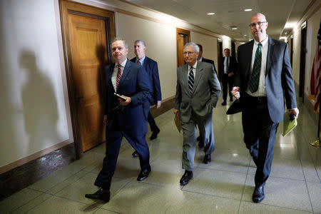 U.S. Senate Majority Leader Mitch McConnell (R-KY) (C) walks to a hearing on Capitol Hill in Washington, U.S. July 20, 2017. REUTERS/Jonathan Ernst