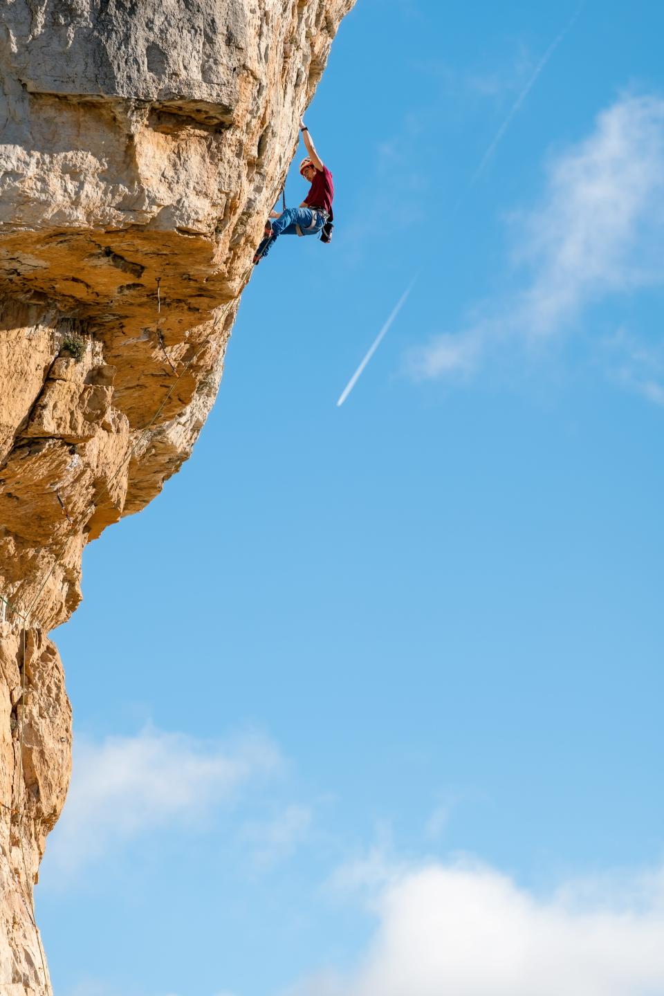 Cat Runner climbs a cliff on "The Climb," a new elimination-style HBO series centered on rock climbing.