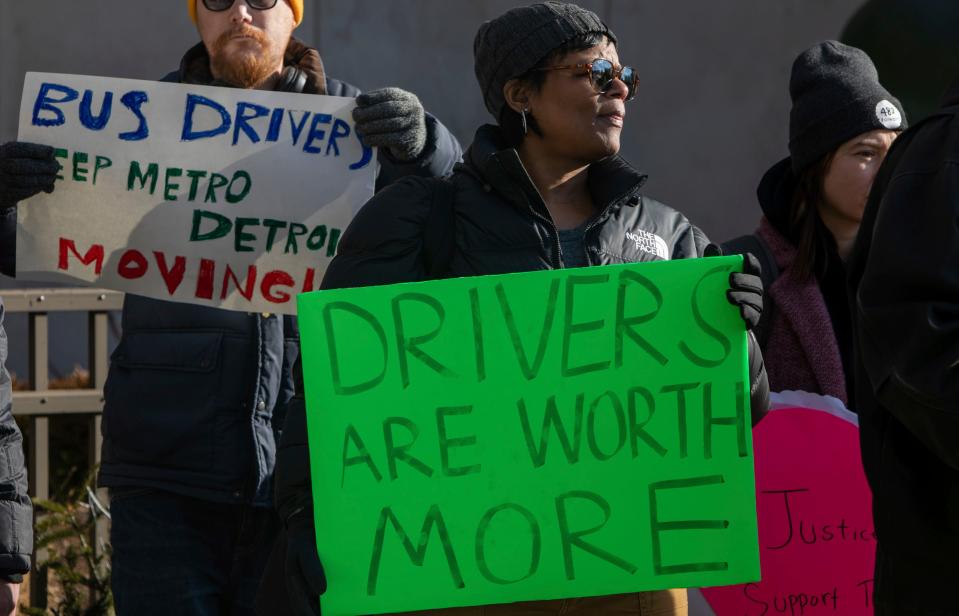 ATU Local 1564 Vice President and SMART bus driver for 30 years, Miquita Burton, of Detroit, holds a sign that reads bus drivers are worth more during a rally for better bus services outside the Coleman A. Young Municipal Center in Detroit on Feb. 14, 2023.