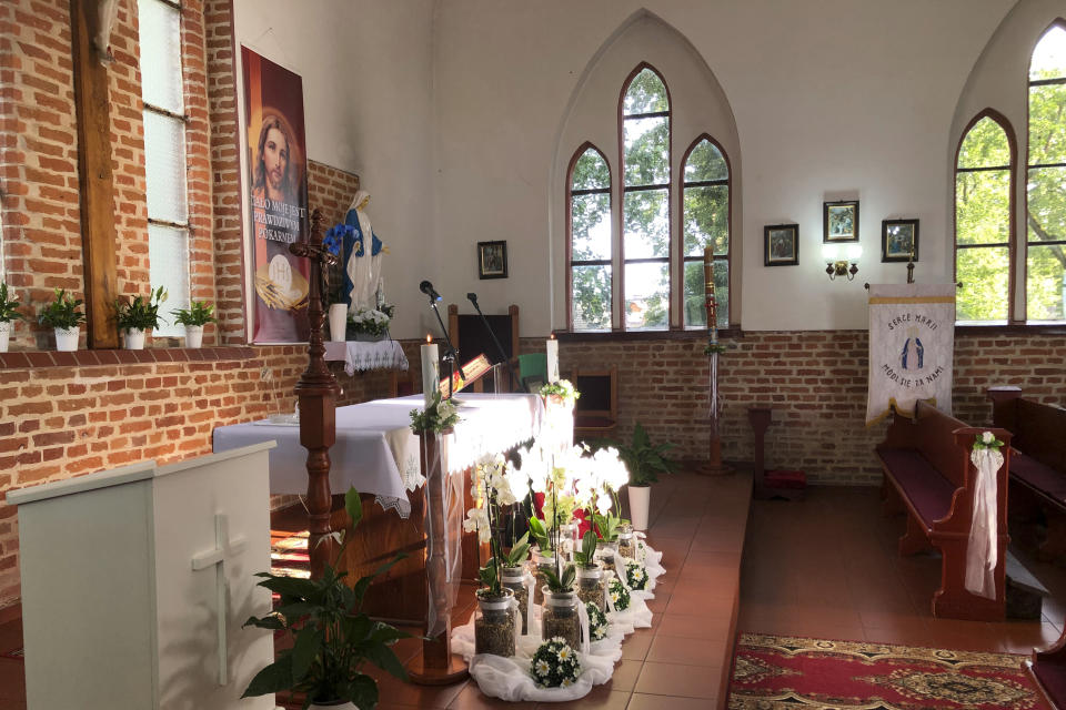 A view inside the Roman Catholic church where it is believed that Danish King Harald Gormsson was buried, in Wiejkowo, Poland, Saturday, July 30, 2022. More than 1,000 years after his death in what is now Poland, a Danish king whose nickname is known to the world through the Bluetooth technology is at the center of an archeological dispute. A Polish researcher and a Swedish archeologist claim that they have pinpointed the probable burial site for King Harald Bluetooth Gormsson in a small village in northwestern Poland, an area that once had ties with the Vikings. (AP Photo Monika Scislowska)