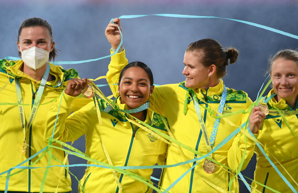 Tahlia McGrath, Alana King, Jess Jonassen and Alyssa Healy, pictured here celebrating Australia's cricket gold medal at the Commonwealth Games.