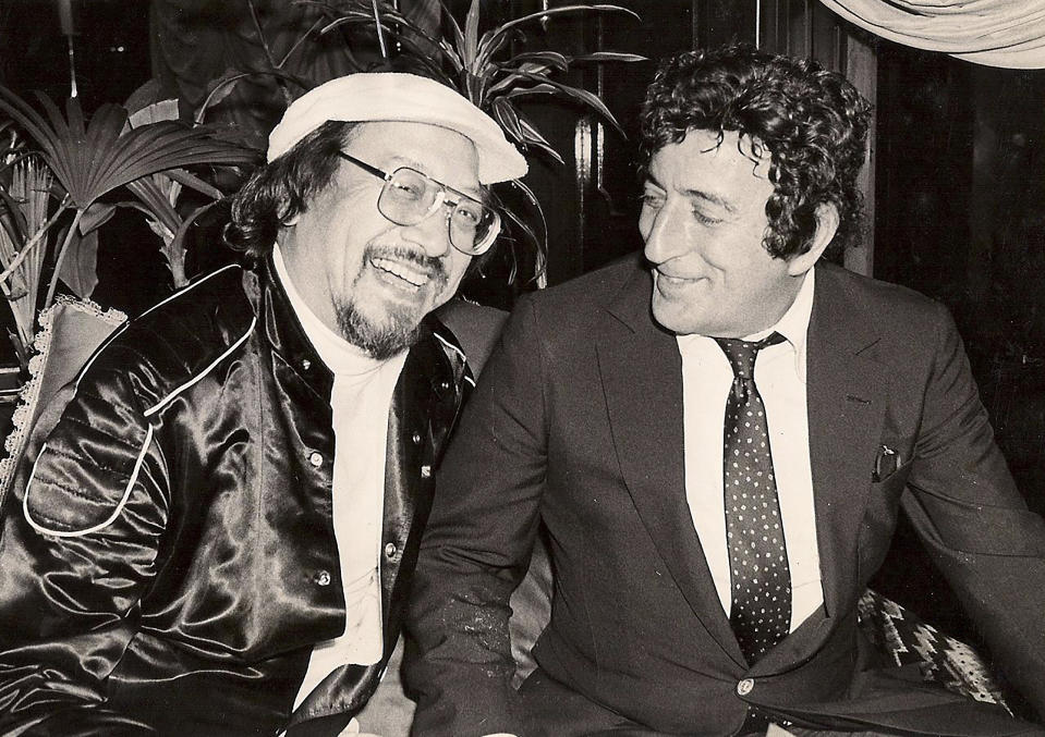 In this undated photo released by Radio Television Hong Kong, Hong Kong DJ, Ray Cordeiro, left, also known as Uncle Ray, interviews American singer Tony Bennett in Hong Kong. After more than seven decades in radio, the 96-year-old Hong Kong DJ bid farewell to his listeners Saturday, May 15, 2021 with “Time to Say Goodbye,” sung by Sarah Brightman and Andrea Bocelli. (Radio Television Hong Kong via AP)