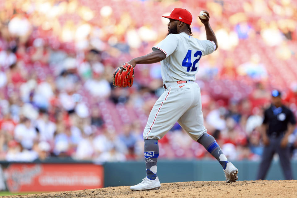 Philadelphia Phillies' Josh Harrison throws during the eighth inning of a baseball game against the Cincinnati Reds in Cincinnati, Saturday, April 15, 2023. (AP Photo/Aaron Doster)