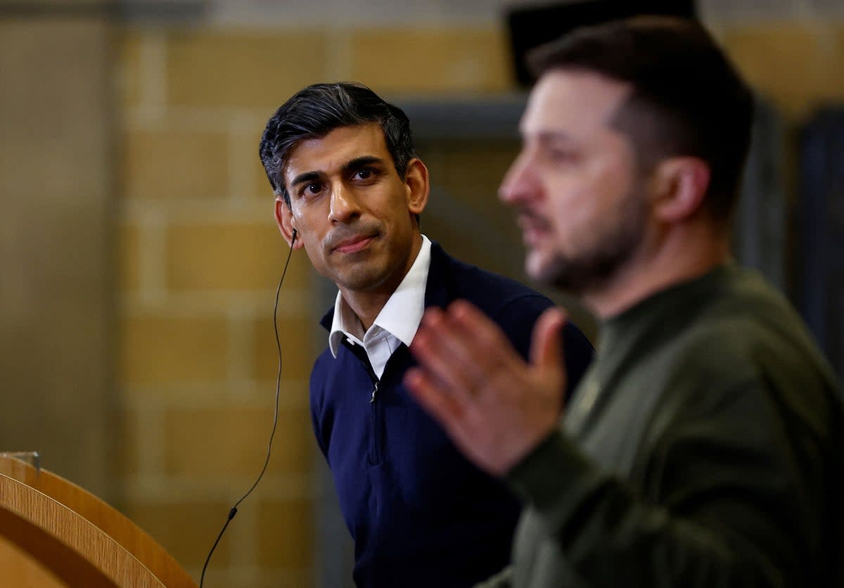 Prime minister Rishi Sunak listens to Volodymyr Zelensky speak at a press conference at an RAF training facility in Dorset (AFP via Getty)