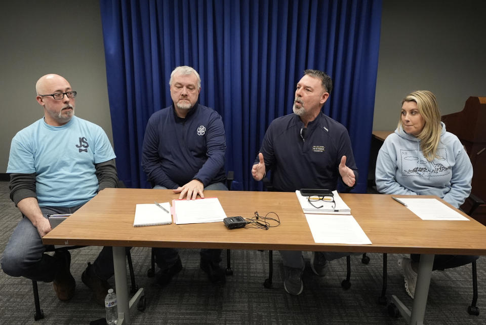 The parents of four students killed in a shooting in Michigan more than two years ago are interviewed Monday, March 18, 2024 in Pontiac, Mich. From left, Craig Shilling, Steve St. Juliana, Buck Myre and Nicole Beausoleil called for a state investigation of all aspects of the 2021 mass shooting, saying a local criminal probe that netted three is not enough to close the book. (AP Photo/Carlos Osorio)