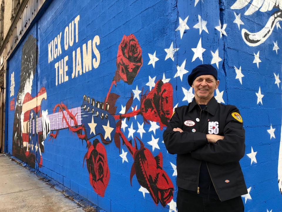 MC5 guitarist Wayne Kramer in front of the new MC5 mural at the Grande Ballroom in Detroit.
