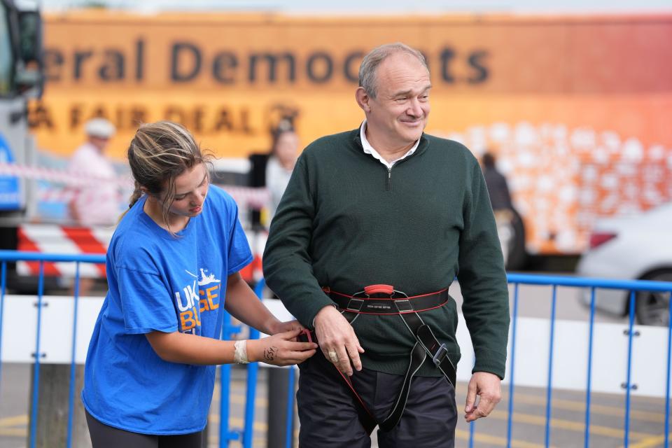 Liberal Democrat leader Sir Ed Davey getting prepared for a bungee jump during a visit to Eastbourne Borough Football Club in East Sussex, while on the General Election campaign trail. Picture date: Monday July 1, 2024.