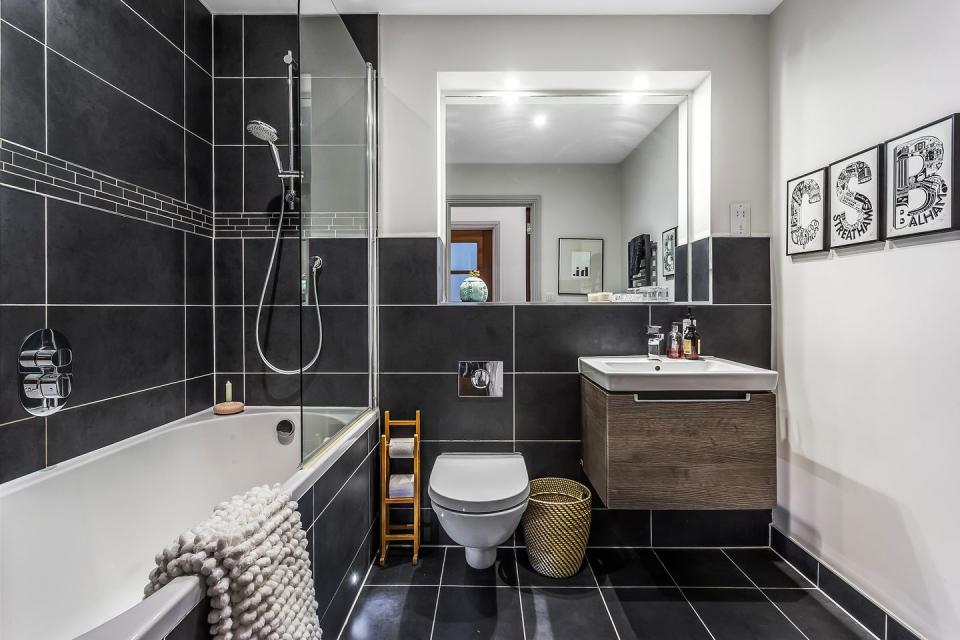 a black tiled bathroom