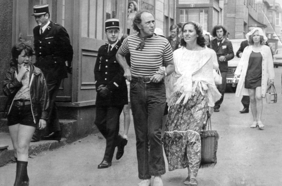 Canadian Prime Minister Pierre Trudeau and his wife Margaret walk along a street on the small French territorial island of St. Pierre Tuesday, August 4, 1971. The Trudeau's made a short unofficial visit to the island, which is off the east coast of Canada, during a tour of Canada's eastern provinces. (CP PHOTO/Peter Bregg)