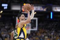 Indiana Pacers' Tyrese Haliburton shoots during the second half of Game 4 of the first round NBA playoff basketball series against the Milwaukee Bucks, Sunday, April 28, 2024, in Indianapolis. (AP Photo/Michael Conroy)