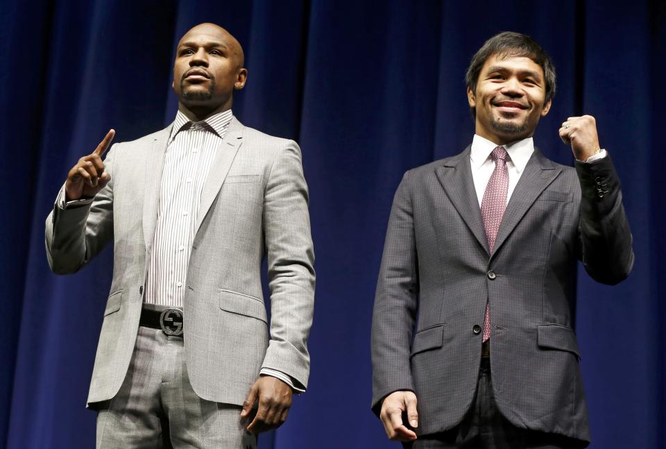 Eleven-time, five-division world boxing champion Floyd "Money" Mayweather and eight-division world champion Manny "Pac-Man" Pacquiao attend a press conference  in Los Angeles,