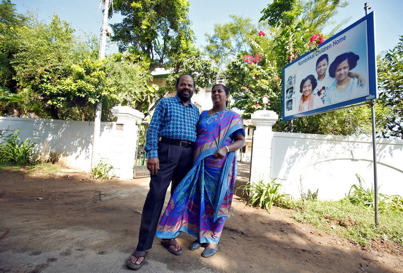 Karibeeran Paramesvaran and his wife Choodamani, who lost three children in the 2004 tsunami, pose outside their house that they have turned into a care home for orphaned children in Nagapattinam district in the southern state of Tamil Nadu, India