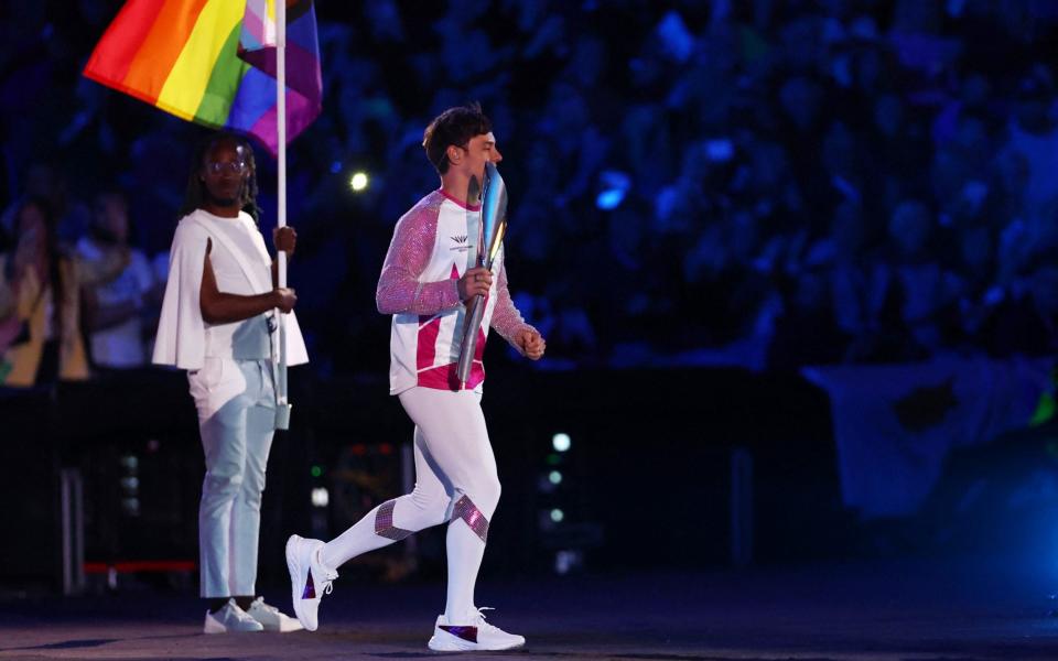 Tom Daley carries the Queens Baton during the opening ceremony - REUTERS