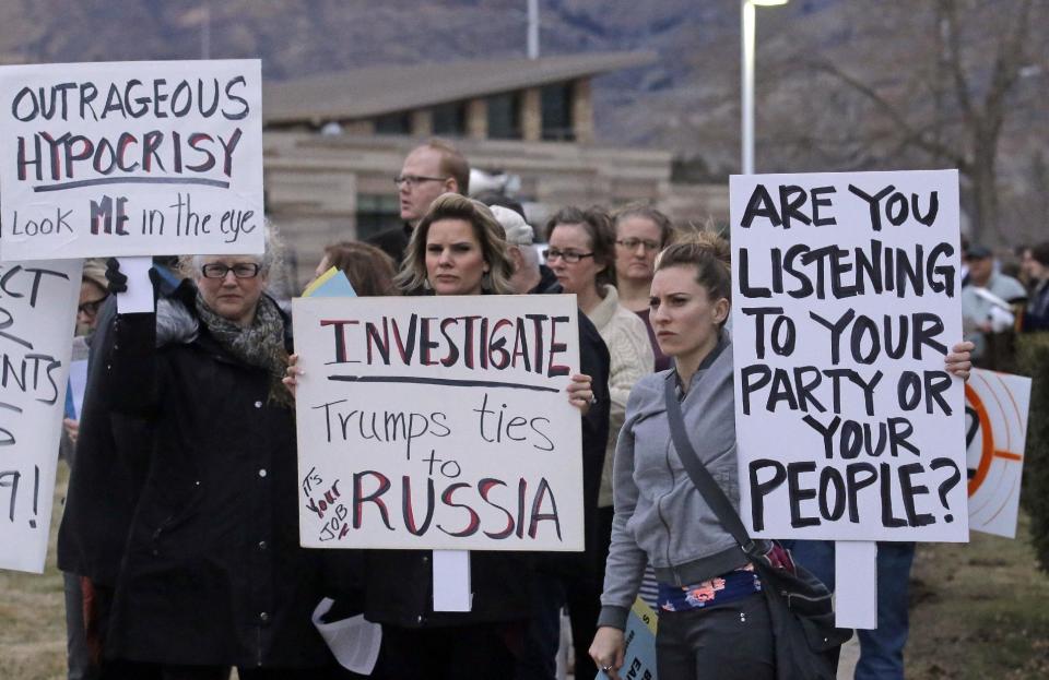People gather outside the Brighton High School before Rep. Jason Chaffetz's town hall meeting Thursday, Feb. 9, 2017, in Cottonwood Heights, Utah. His visit came as the congressman spends time in his home state, visiting with Muslim leaders and holding a town hall Thursday. (AP Photo/Rick Bowmer)