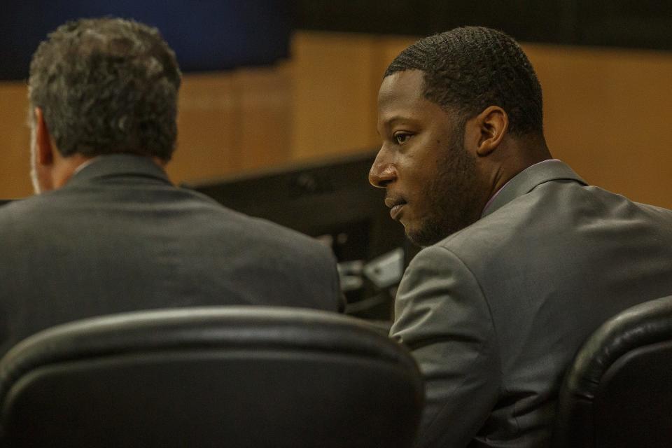 Euri Jenkins, right, talks with his attorney Gregg Lerman during a recess at his trial in the Palm Beach County Courthouse in downtown West Palm Beach, Fla., on Thursday, April 28, 2022. Jenkins was indicted in 2017 on a first-degree murder charge in the death of his wife Makeva Jenkins.