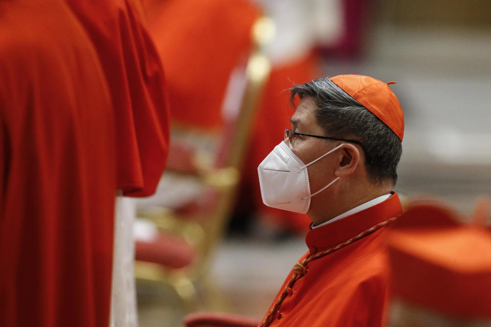 Cardinal Luis Antonio Tagle wears protective masks during a consistory ceremony where 13 bishops were elevated to a cardinal's rank in St. Peter’s Basilica at the Vatican, Saturday, Nov. 28, 2020. (Fabio Frustaci/POOL via AP)