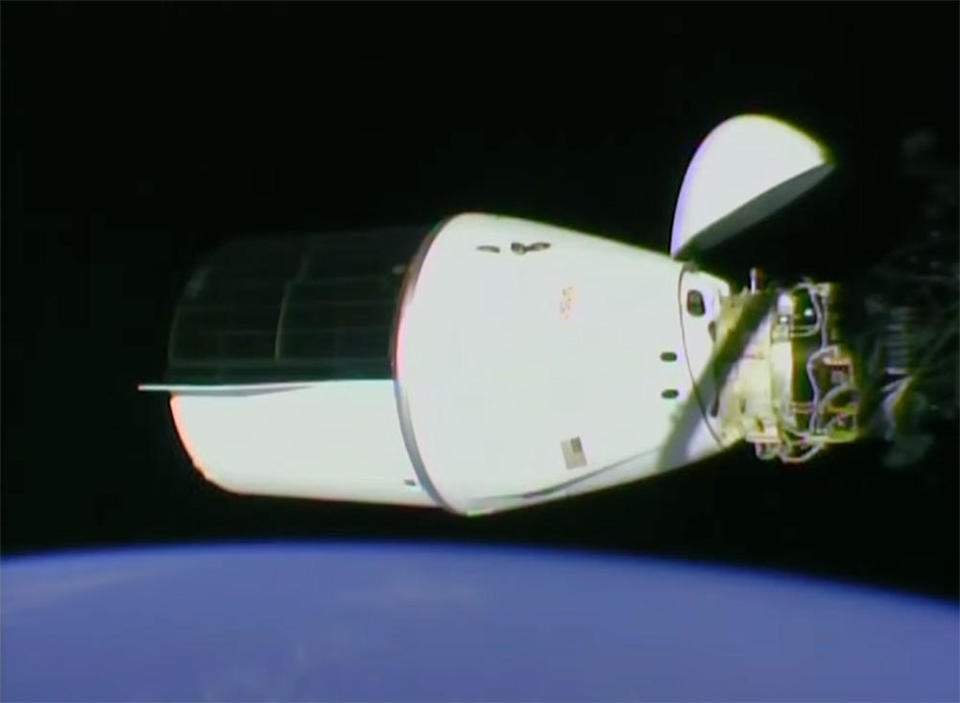 The Dragon docked at the space station's forward port at 11:21 a.m. EDT Saturday to wrap up an automated two-day rendezvous. / Credit: NASA TV