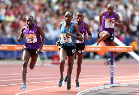 Athletics - IAAF Diamond League 2015 - Sainsbury's Anniversary Games - Queen Elizabeth Olympic Park, London, England - 25/7/15 Kenya's Paul Kipsiele Koech, Kenya's Jairus Kipchoge Birech and Kenya's Conseslus Kipruto in action during the Men's 3000m Steeplechase Action Images via Reuters / Matthew Childs