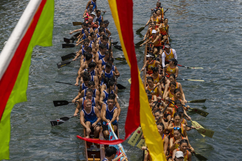 Competitors take part in the annual dragon boat race to celebrate the Tuen Ng festival in Hong Kong, Thursday, June 22, 2023. (AP Photo/Louise Delmotte)