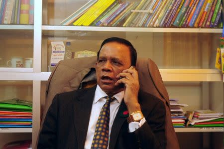 Mahbub Uddin Khokon, a National Unity Front alliance candidate contesting in the 11th general election, talks over phone while sitting inside a district court in Noakhali, Bangladesh, December 23, 2018. REUTERS/Zeba Siddiqui