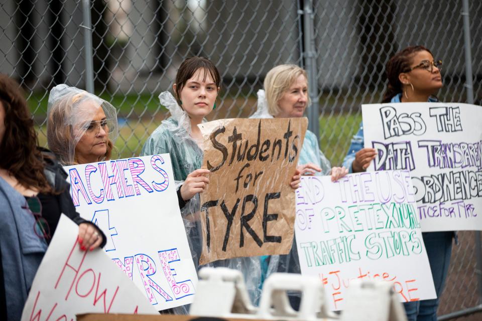 Demonstrators hold up signs in support of Tyre Nichols and the six ordinances put forward in front of Memphis City Council during a rally organized by MICAH, Memphis Interfaith Coalition for Action and Hope, to demand the city council votes to support six ordinances regarding public safety and police reform outside Memphis City Hall on March 2, 2023. 