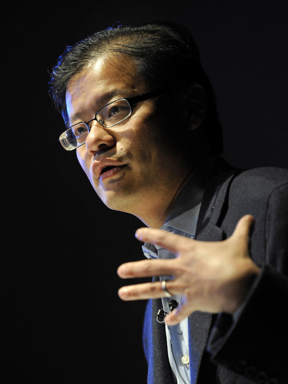 Yang, CEO and co-founder of Yahoo!, gestures as he addresses a conference in central London.
