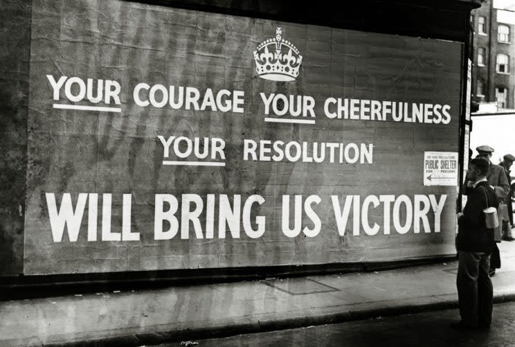 A poster on a London street in September 1939 praises courage, cheerfulness and resolution