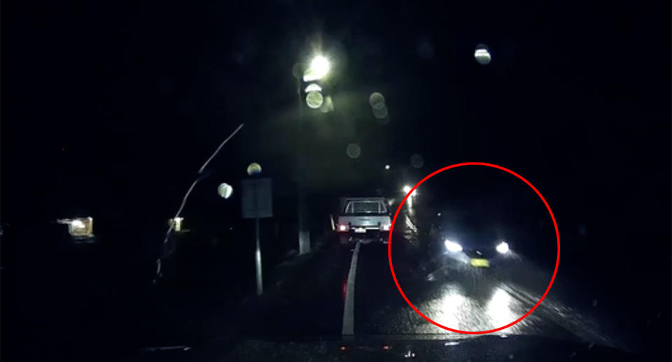 Dashcam vision shows a blue car crossing into the wrong lane, driving head-on towards the car that's filming.