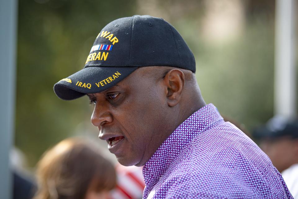 Arizona state representative Walt Blackman passes out candidate literature during the Arizona for Life rally in Phoenix on Jan. 15, 2022.