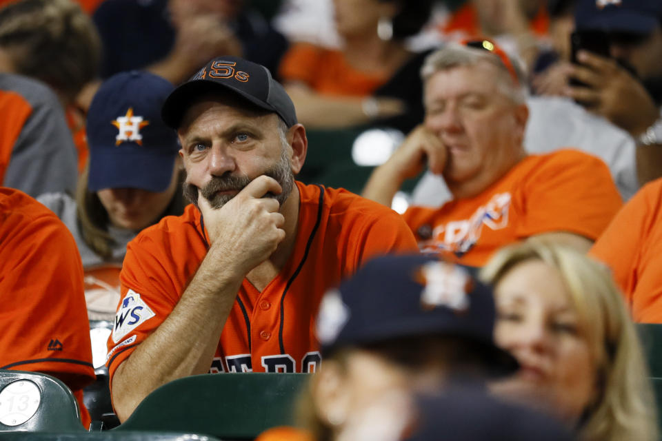 Fans watch during the eighth inning of Game 2 of the baseball World Series between the Houston Astros and the Washington Nationals Wednesday, Oct. 23, 2019, in Houston.(AP Photo/Matt Slocum)