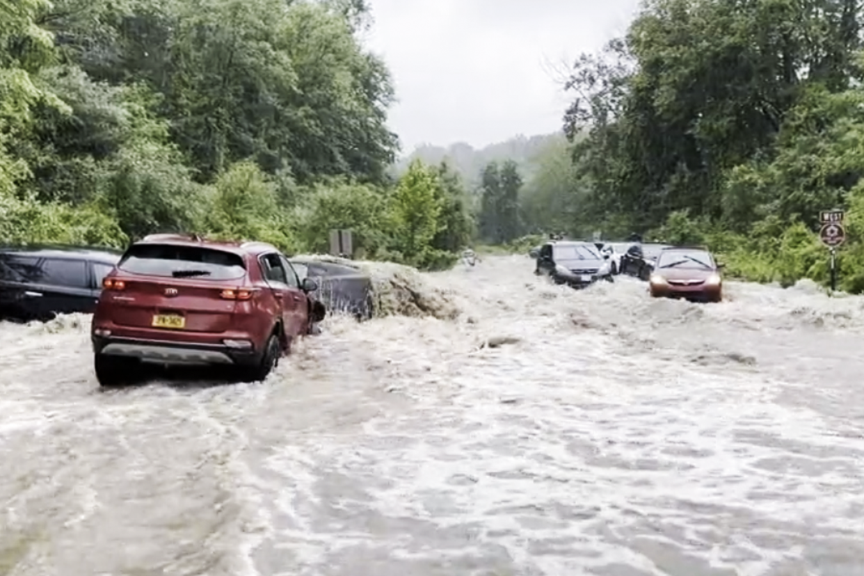 Cars were left stranded by flooding Sunday near Woodbury and Harriman in Orange County, N.Y. (Manny Casais / NBC News)