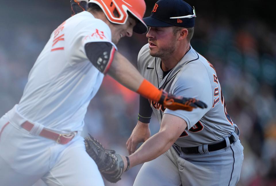 Tigers first baseman Spencer Torkelson tags Giants right fielder Mike Yastrzemski along the first base line in the bottom of the first inning on Tuesday, June 28, 2022, in San Francisco.
