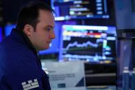 Traders work on the floor of the NYSE in New York