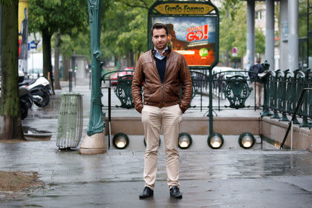 Aymeric Durox, a teacher and supporter of Marine Le Pen, French National Front (FN) candidate for 2017 presidential election, poses in front of a metro station in Paris, France, May 3, 2017. REUTERS/Charles Platiau