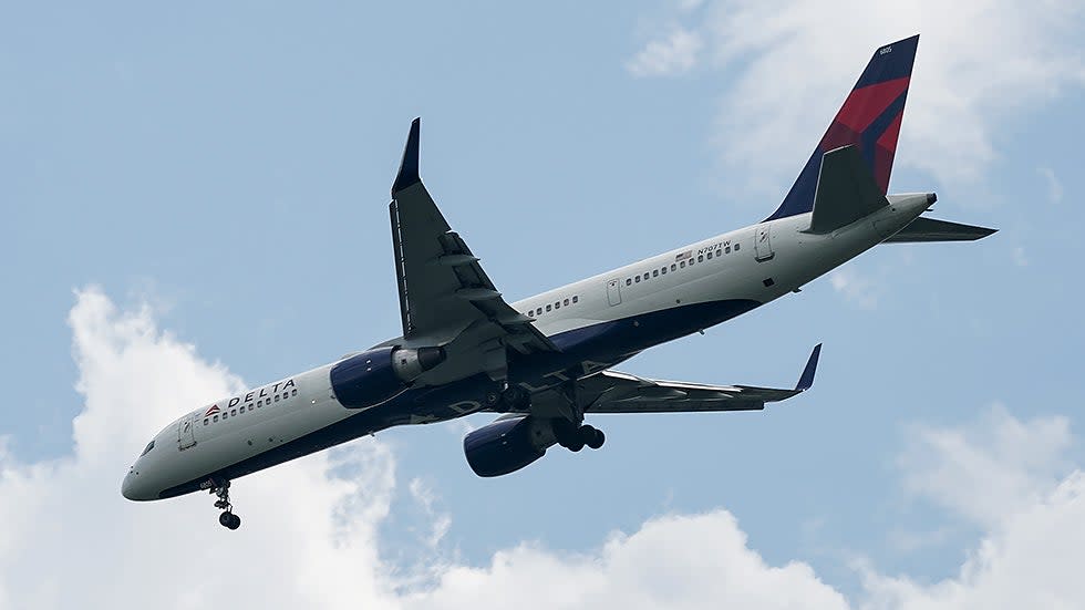 A Delta Airlines Boeing 757 seen from the National Mall in Washington, D.C., makes its final descent into Ronald Reagan National Airport in Arlington, Va., on July 14
