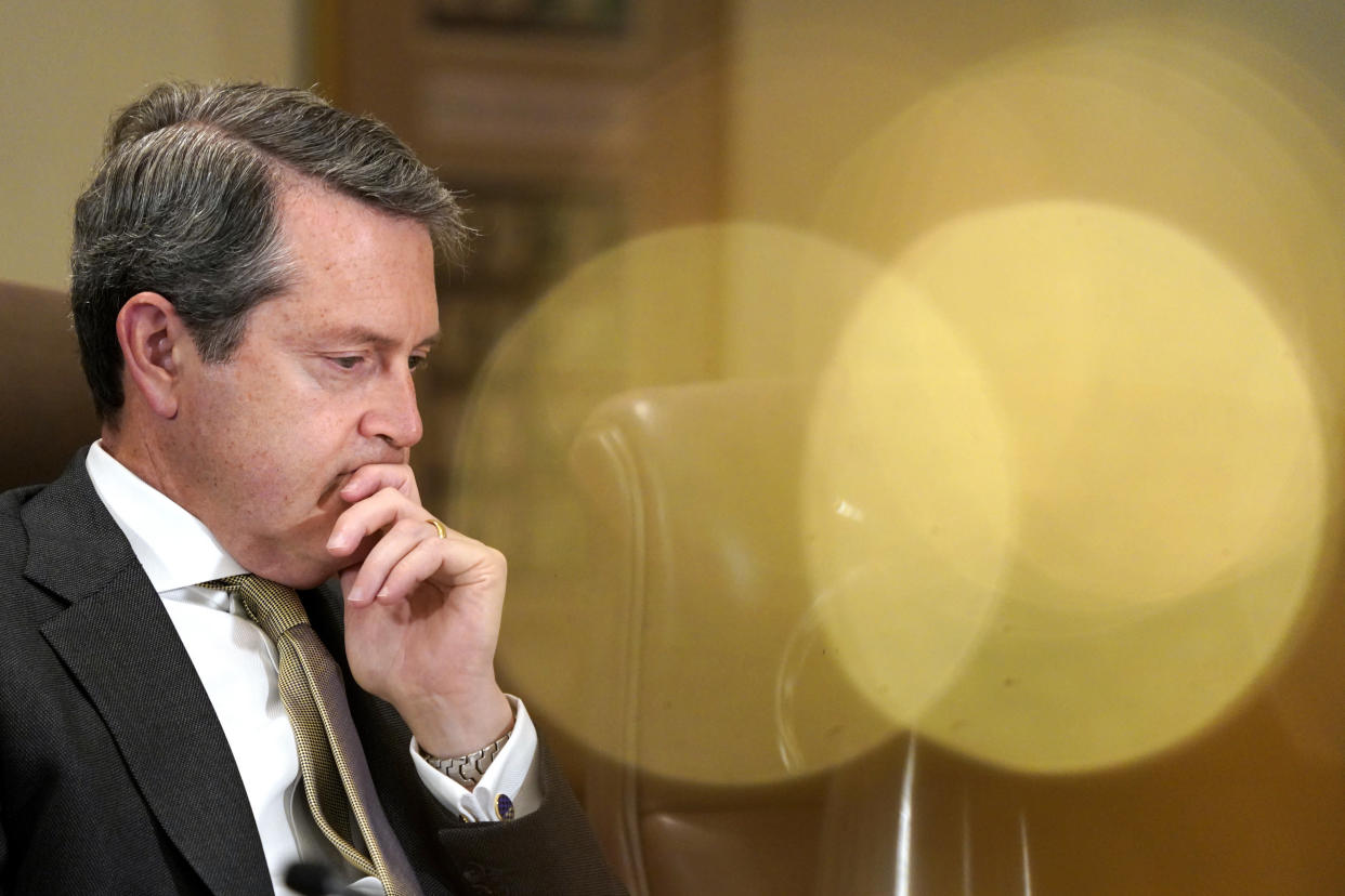 Randal Quarles, Federal Reserve vice chair for supervision, listens during a Federal Reserve Board meeting to discuss proposed rules to modify the enhanced prudential standard framework for large banking organizations, Wednesday, Oct. 31, 2018, at the Marriner S. Eccles Federal Reserve Board Building in Washington. (AP Photo/Jacquelyn Martin)