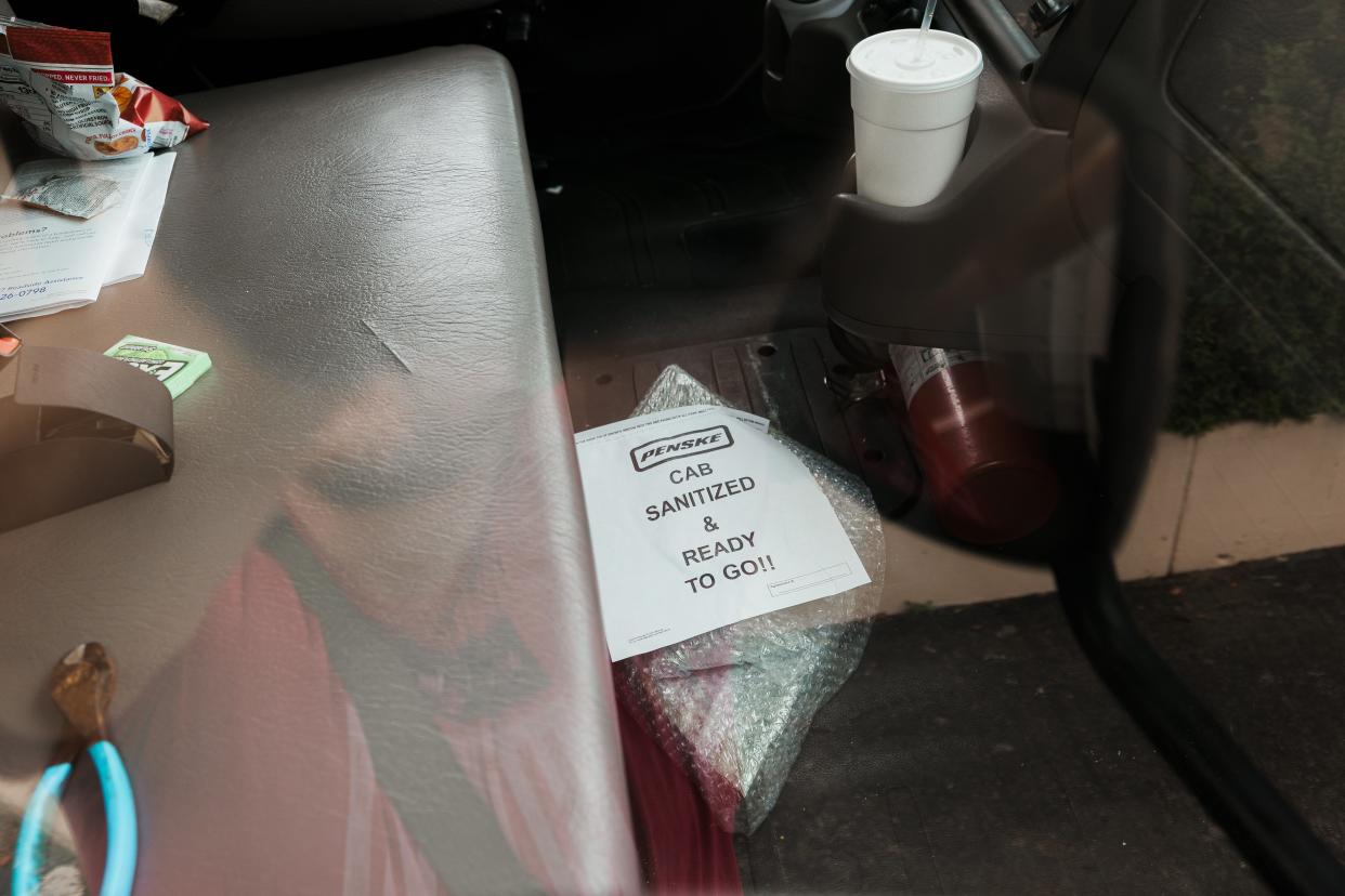 In the cab of the truck, a diamond shaped object that appears to be the ashtray from Shin'enKan designed by Bruce Goff.