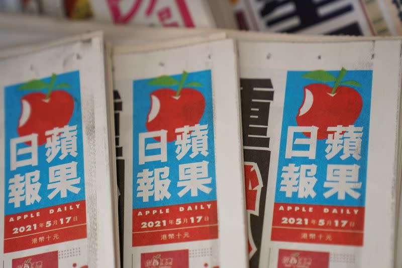 FILE PHOTO: Copies of Next Digital's Apple Daily newspapers are seen at a newsstand in Hong Kong